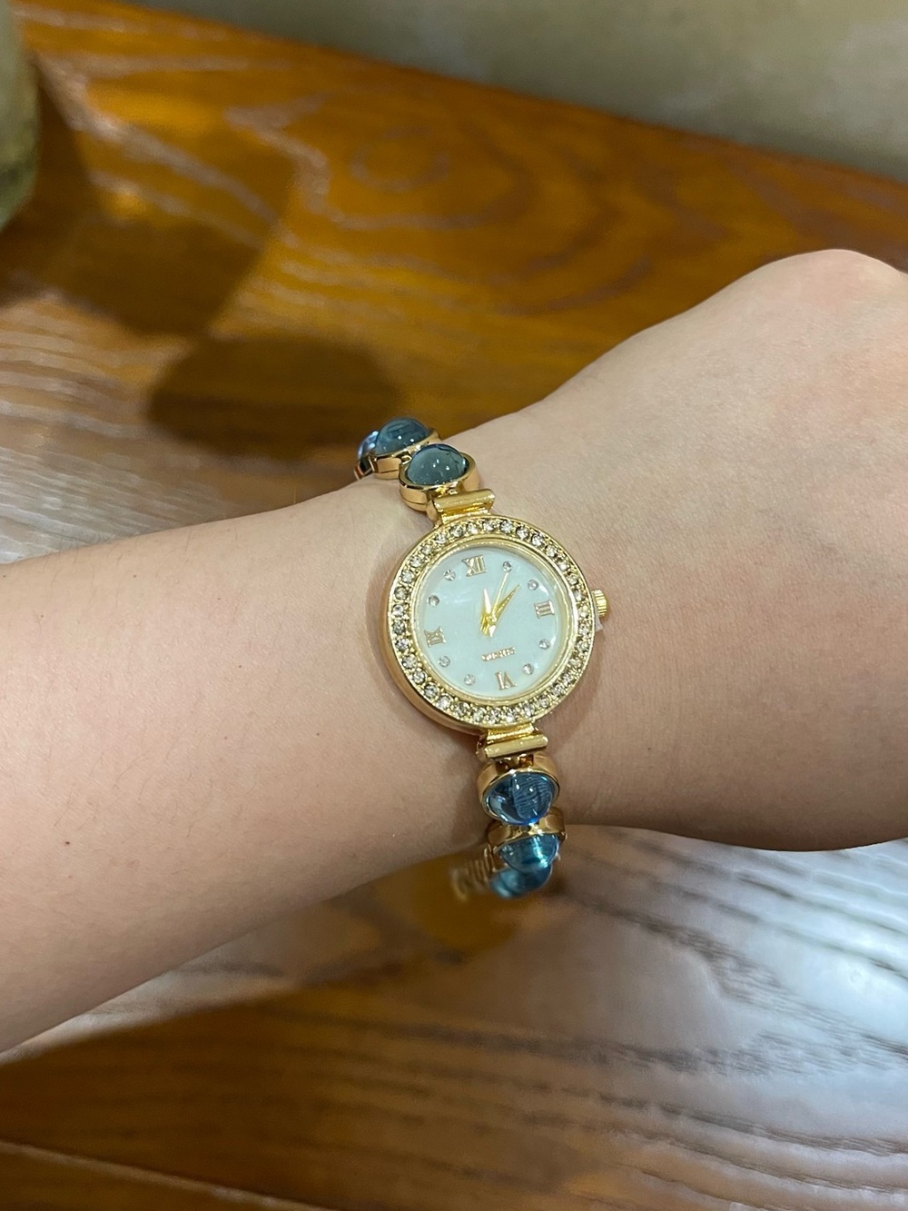 Gold-Tone Women's Bracelet Watch with Blue Stone Accents - battery included